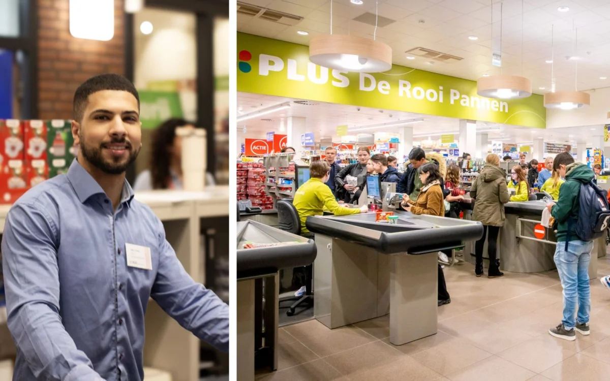 Hamza die achter de kassa een klaant staat te helpen